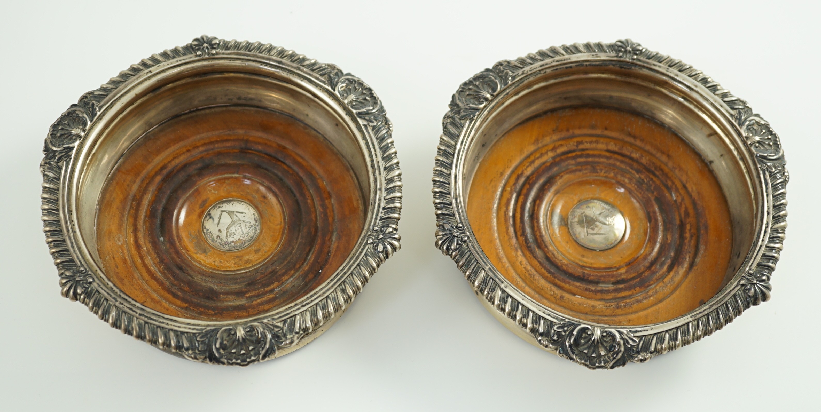 A pair of George IV silver mounted wine coasters by John Walton?